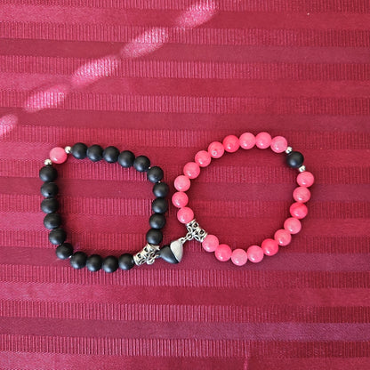 Par de pulseras para pareja rosa y negro con corazón imantado (Nuevo)
